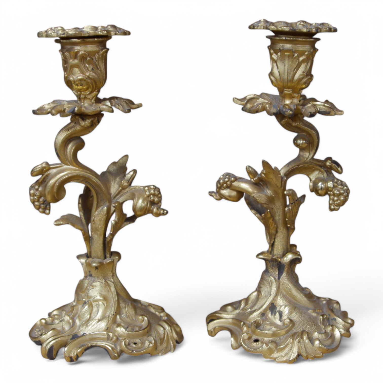 A pair of Louis XV-style ormolu candlesticks, 21cm high. Condition - slight tarnishing